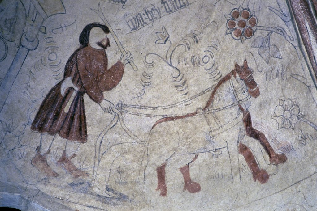 Kalkmålning i Fjälkinge kyrka föreställande en plöjande bonde