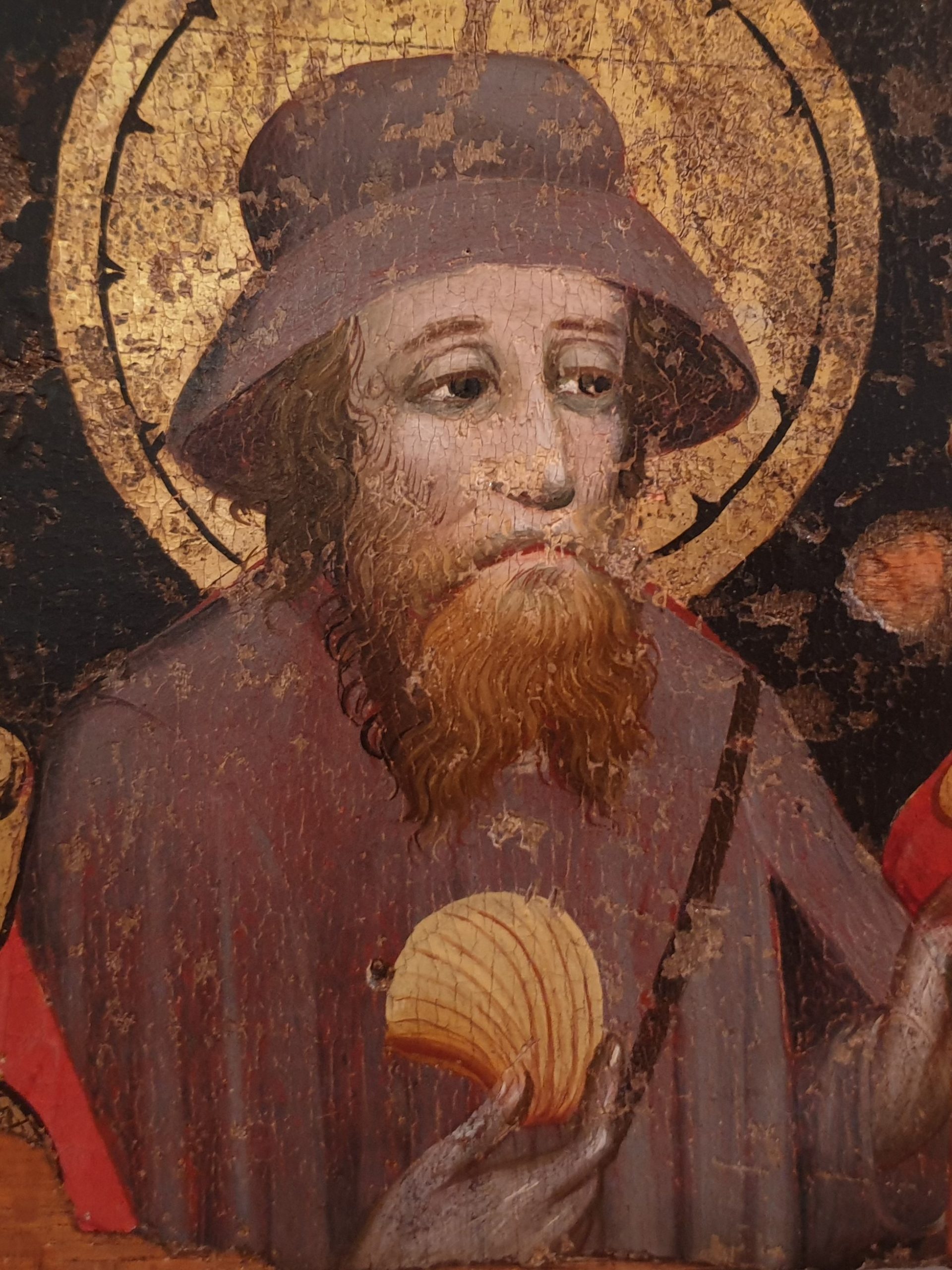 En målning föreställande en skäggig man med brun slokhatt och brun mantel, hållandes en snäcka i höger hand.